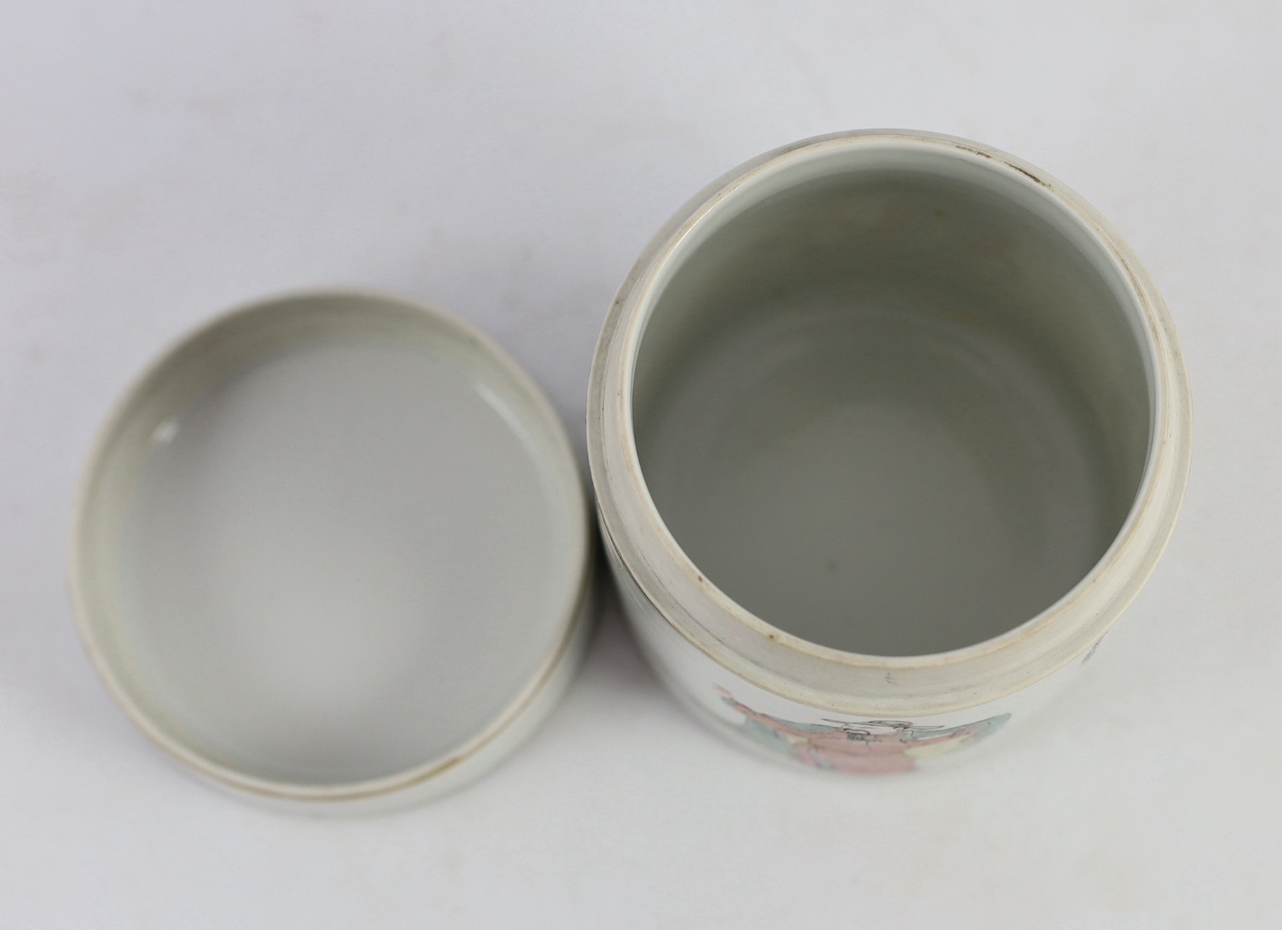 A Chinese famille rose fencai inscribed cylindrical jar and cover, mid 19th century, 11.2cm high